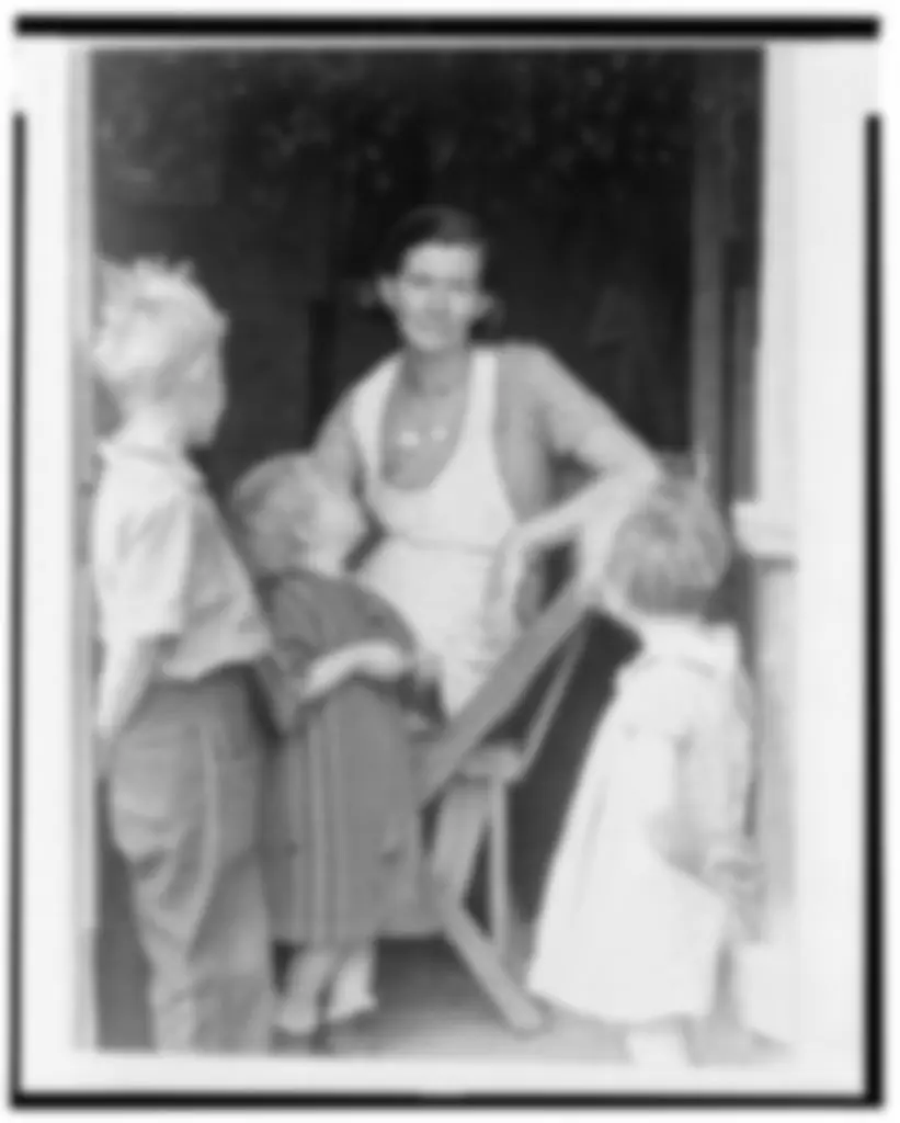 Blurry old photograph of a mother with children