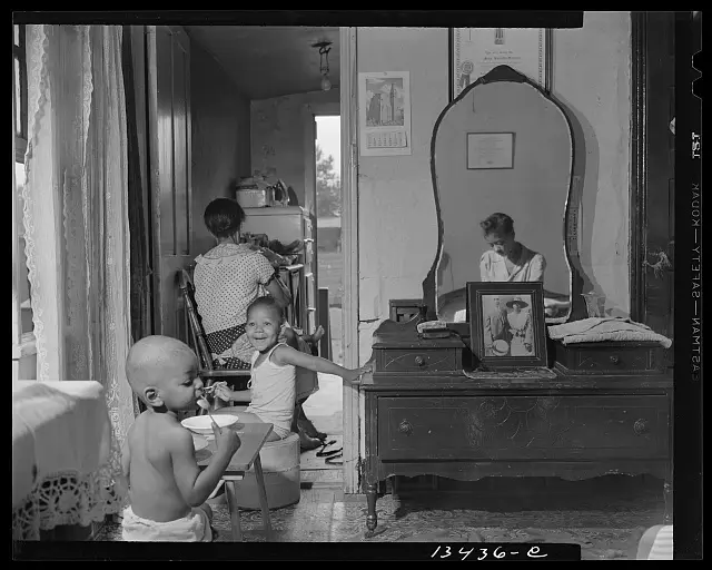 1940s indoor family scene with heavy film grain