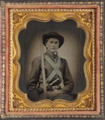 Faded Civil War era glass-plate portrait of a young soldier